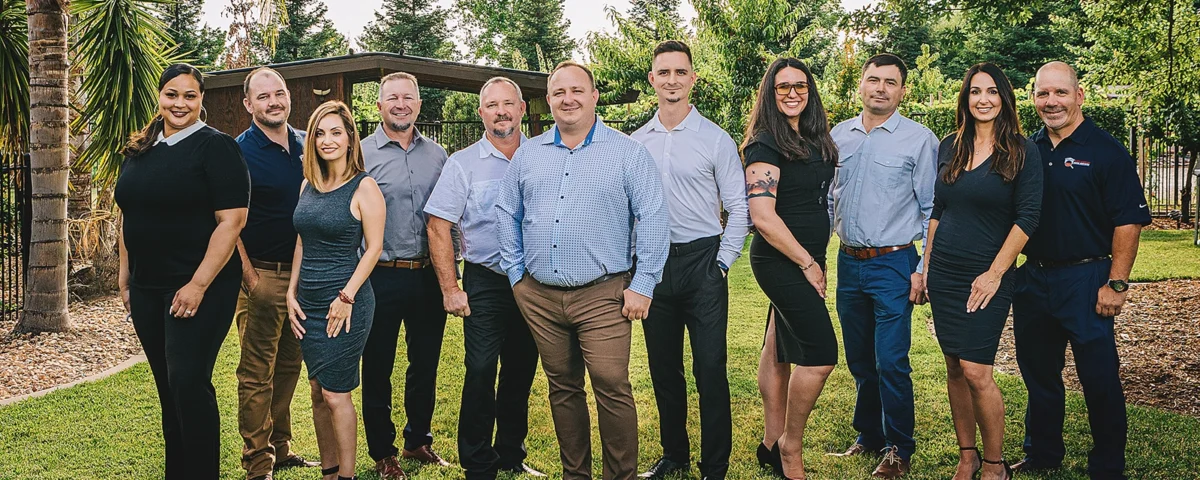 Good Life Construction team standing together for a company group photo.